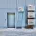 a couple of air conditioners sitting on the side of a building