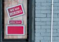a sign that says we are hiring and apply today