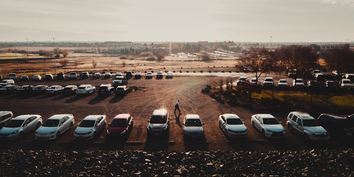 cars parked on parking lot during daytime