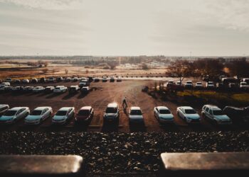 cars parked on parking lot during daytime